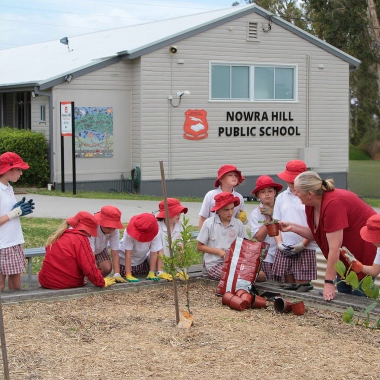 Jo West Principal gardening with some students from Nowra Hill Public School